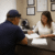 Occupational health professional completing pre-employment medical screenings with a candidate