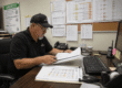 Safety manager reviewing inconsistent drug testing records and operational downtime risks