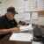 Safety manager reviewing inconsistent drug testing records and operational downtime risks