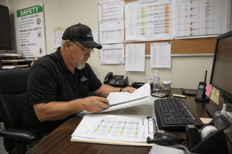 Safety manager reviewing inconsistent drug testing records and operational downtime risks