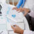 Leaders reviewing occupational health program consistency across multiple locations