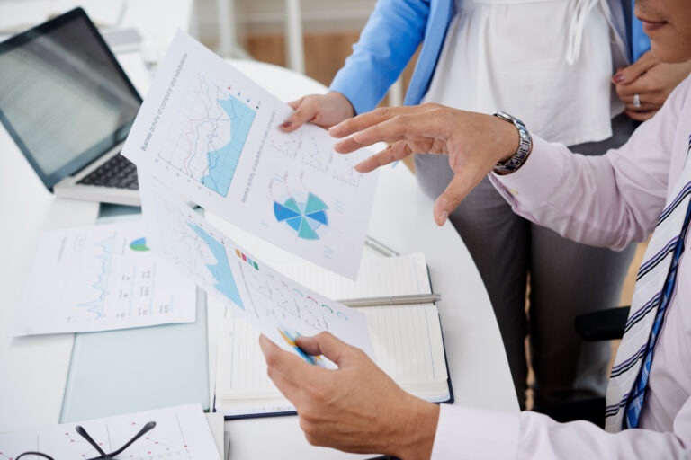 image-funding-warehouse-and-distribution Leaders reviewing occupational health program consistency across multiple locations