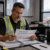 Safety manager reviewing drug testing programs and safety performance records